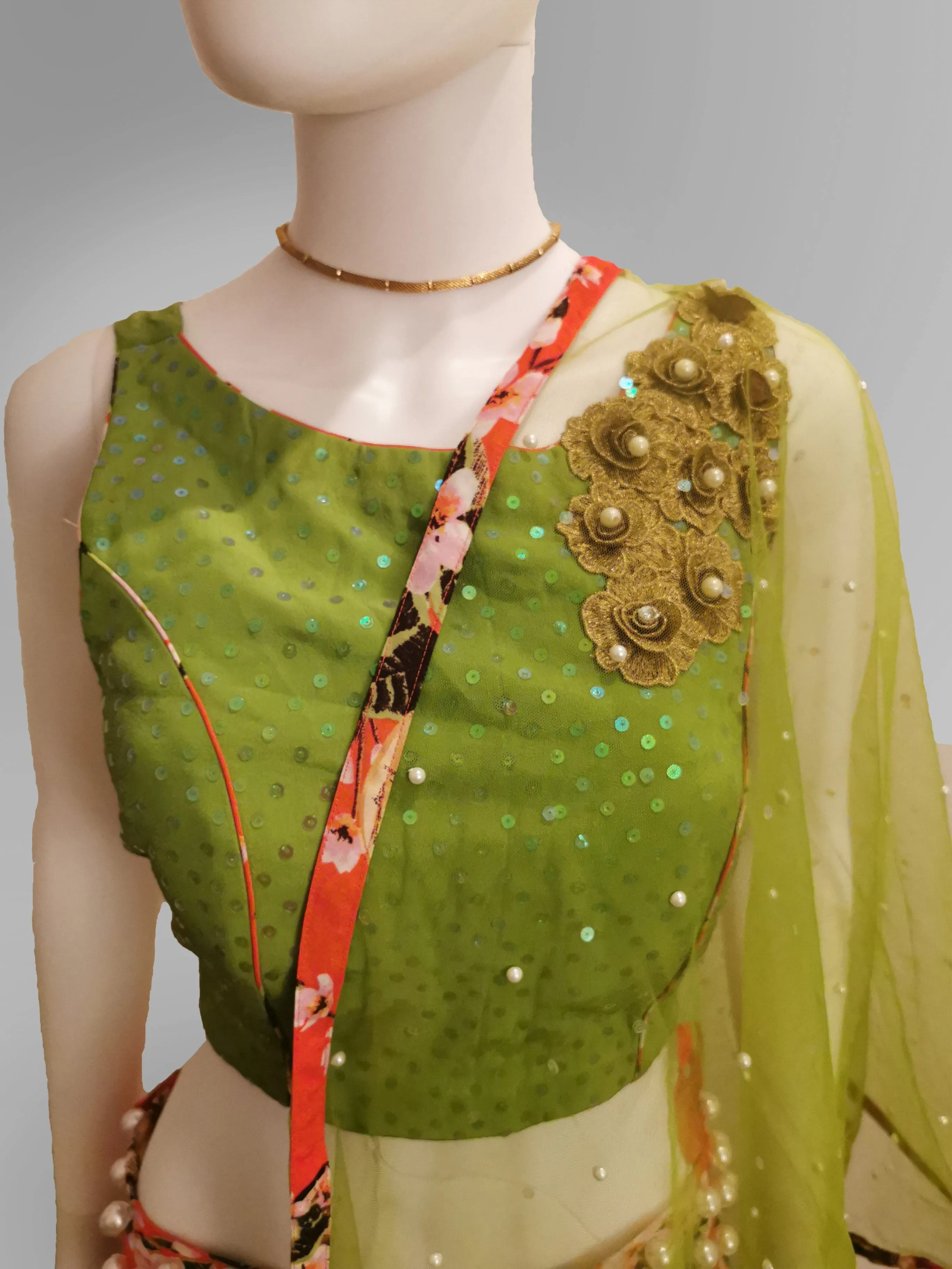 Lehenga in Coral Pink in Floral Motif and Green Strap Blouse