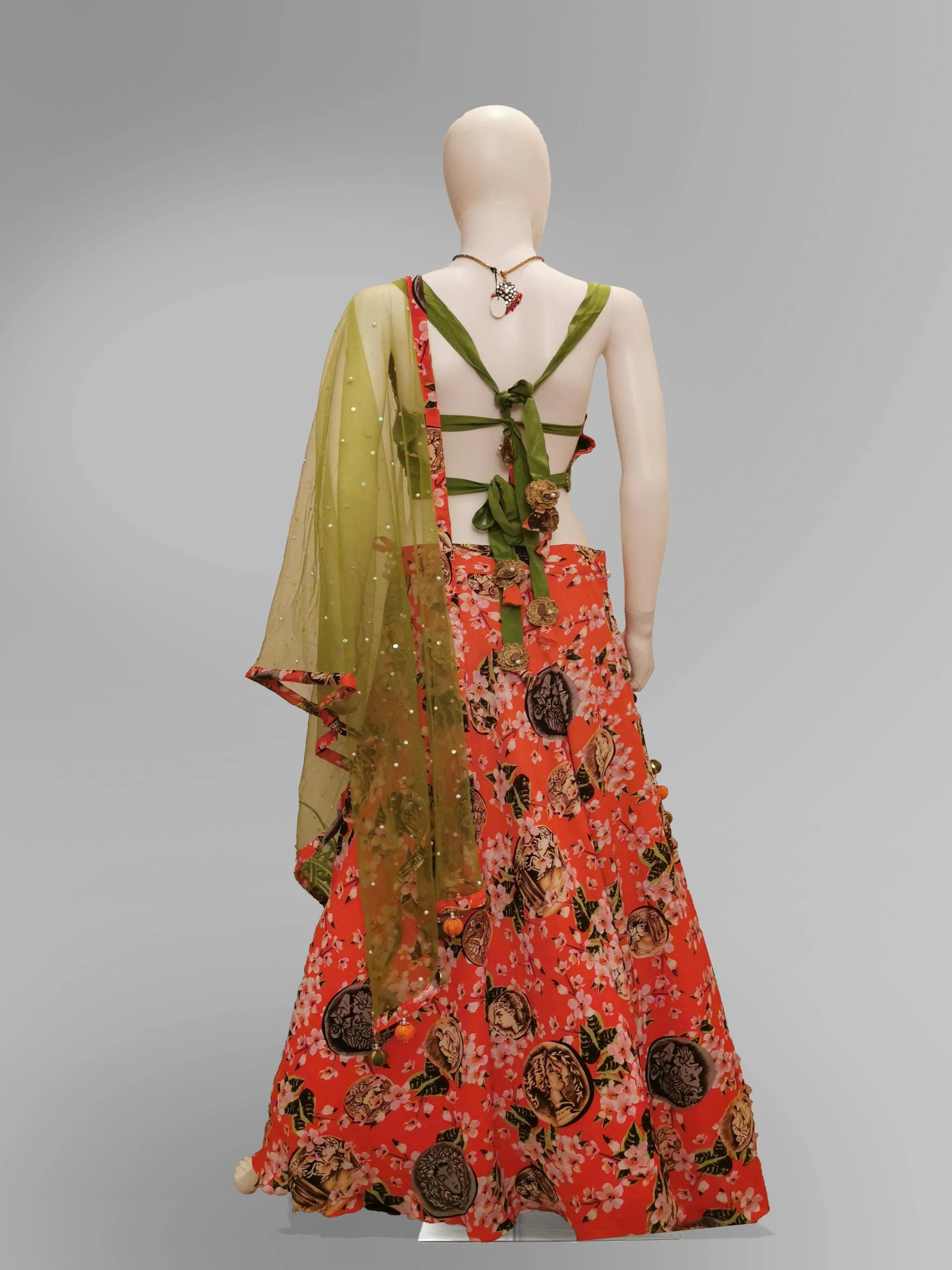 Lehenga in Coral Pink in Floral Motif and Green Strap Blouse