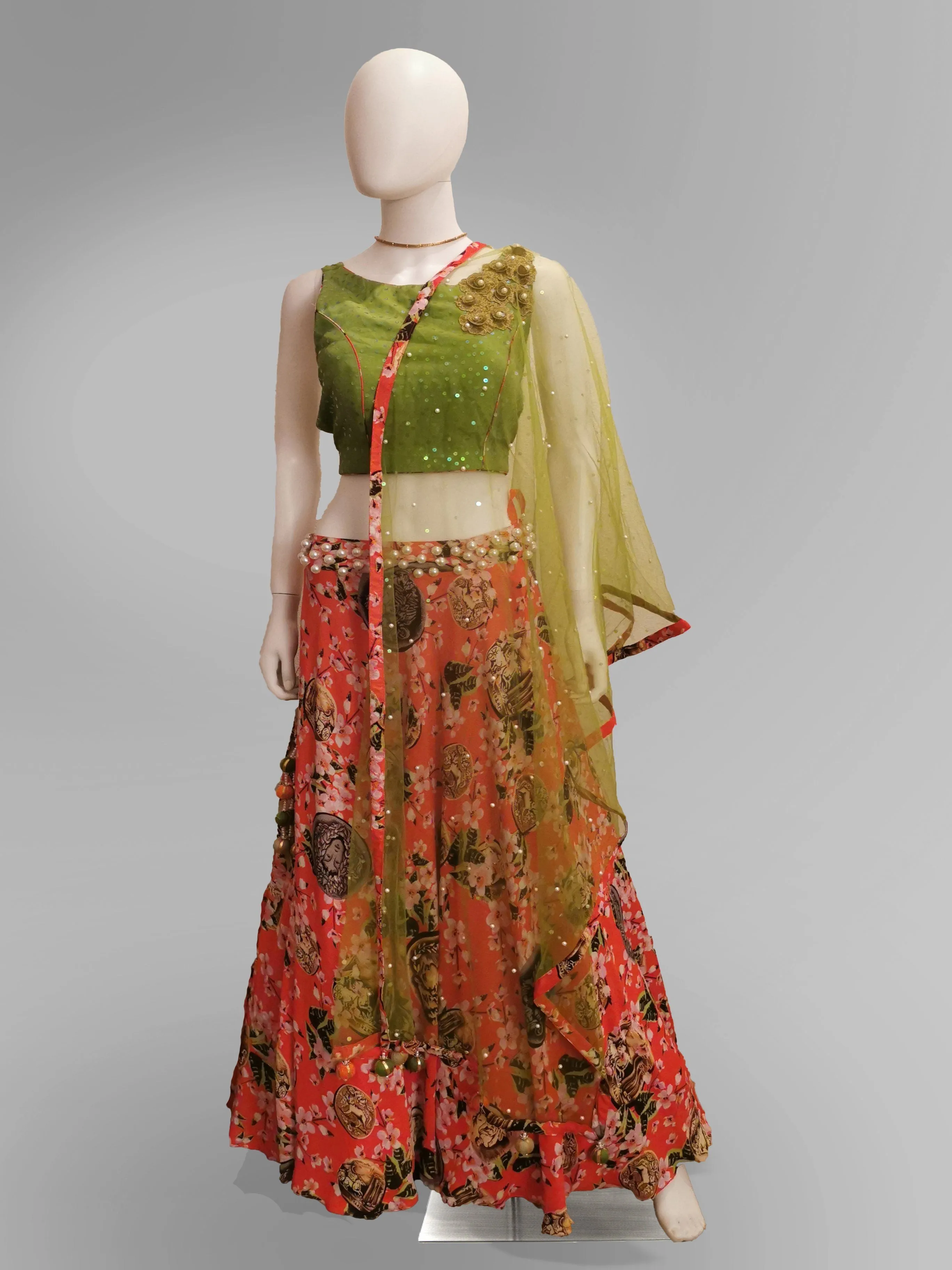 Lehenga in Coral Pink in Floral Motif and Green Strap Blouse